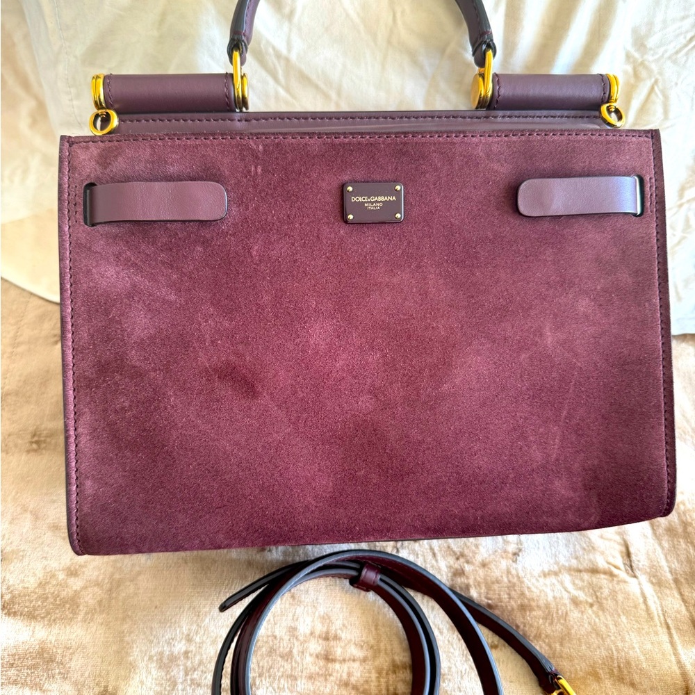 Dolce and Gabbana leather and suede bag with cross body strap and top handle.